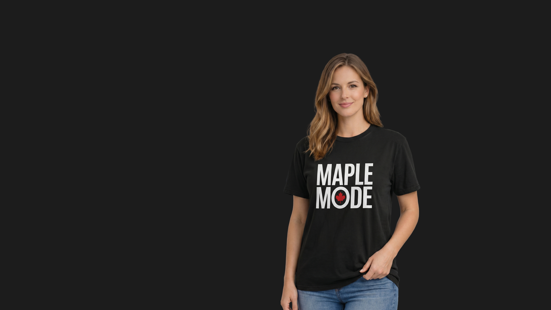A person wearing a black “MAPLE MODE” T‑shirt with a red maple leaf symbol, standing against a dark background. Canada‑Day apparel highlighting modern Canadian pride and minimalist design.